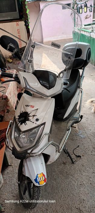Scuter electric în stare bună și asigurat pe un an