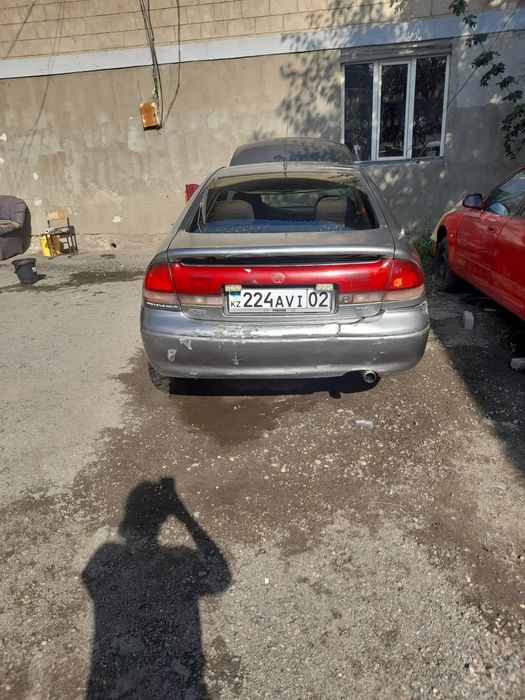 Мазда кроус 626 свет серыи