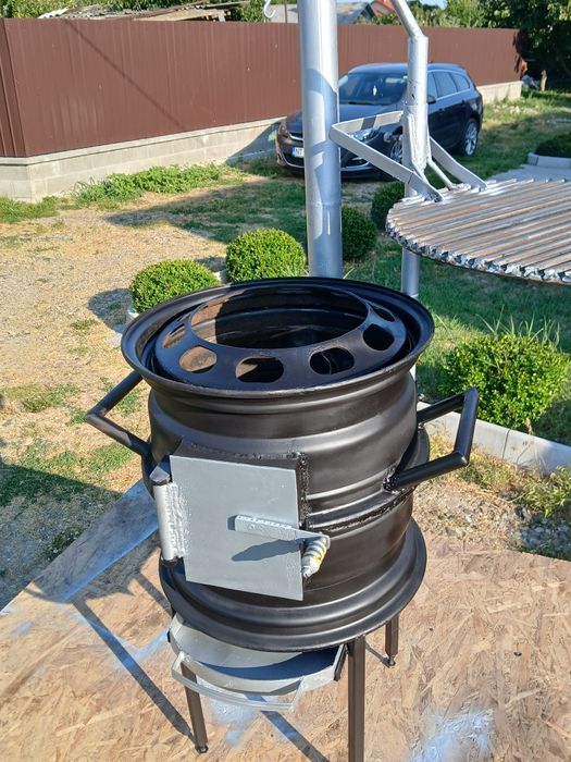 Gătește ca-n natură! Sobiță tip Godin cu grătar reglabil – 650 RON