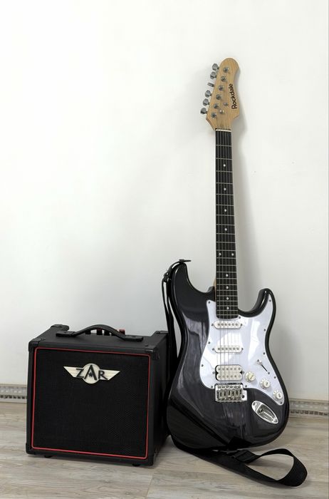 Продам новую электрогитару с комбоусилителем в новом состоянии