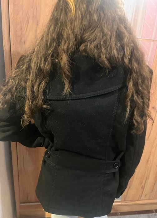 Palton în stare aproape nou