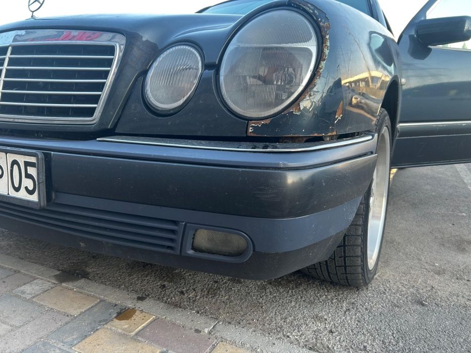 Передний бампер в сборе  Mercedes w210 до рест