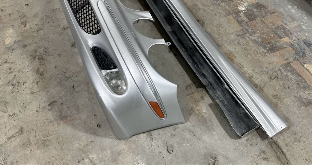 Бампер передней w211