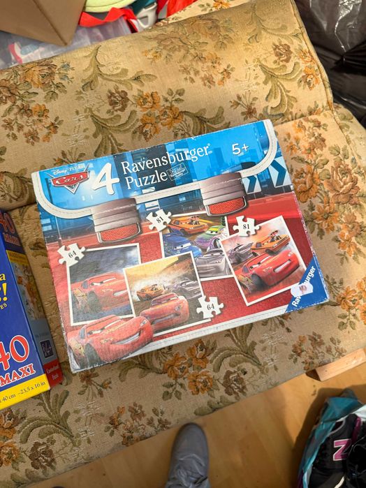 Set 4 puzzle-uri copii Ravensburger – Disney Pixar Cars (2x64 și 2x81 piese)