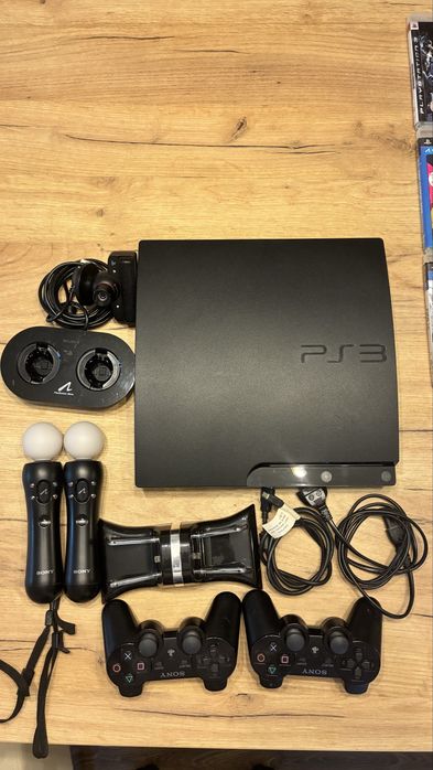 Pachet premium Playstation PS3 Slim + 2 controllere wireless Dual Shock 3 + kit PS Move (2 controllere + camera) + 2 docking stations + 18 jocuri