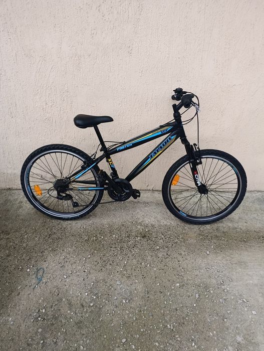 Vând bicicletă copii cu roți pe 24.