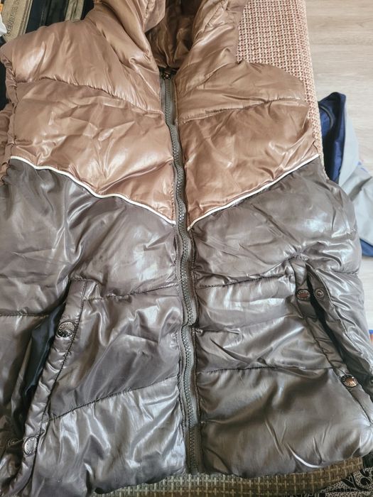 Пуховая жилетка новая