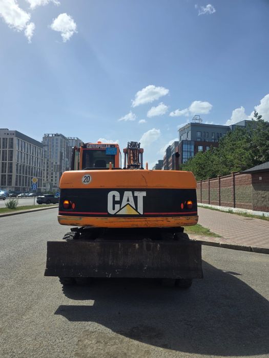 Продаётся колесный экскаватор CAT