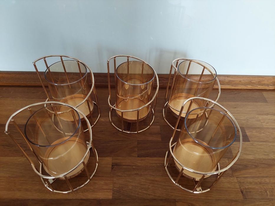 Красиви свещници в цвят розово злато