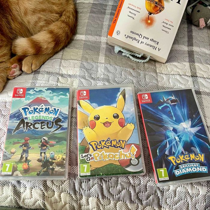 Consola Nintendo Switch + jocuri Pokémon + dock + accesorii (grip 3D + husă)