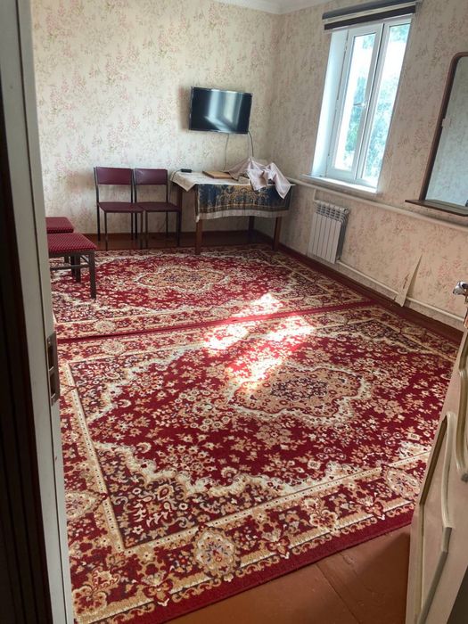 Двухэтажный дом с пристройкой