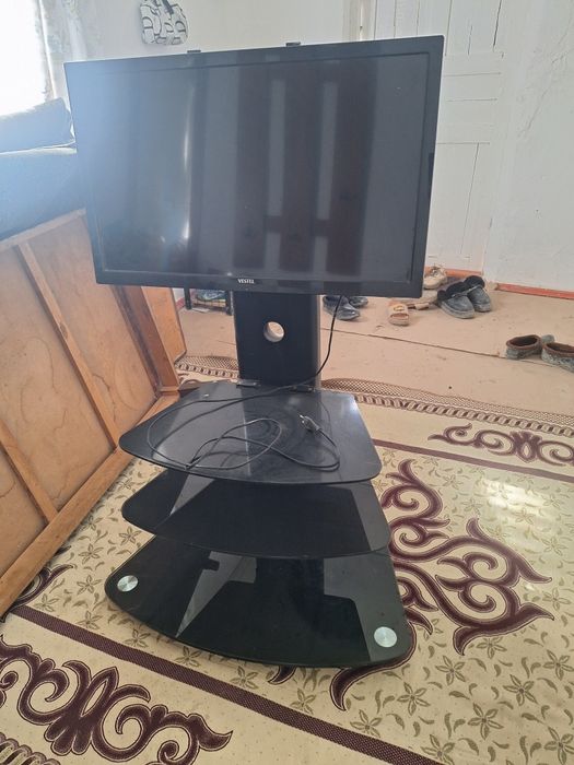 Телевизор подставкасы мен берге