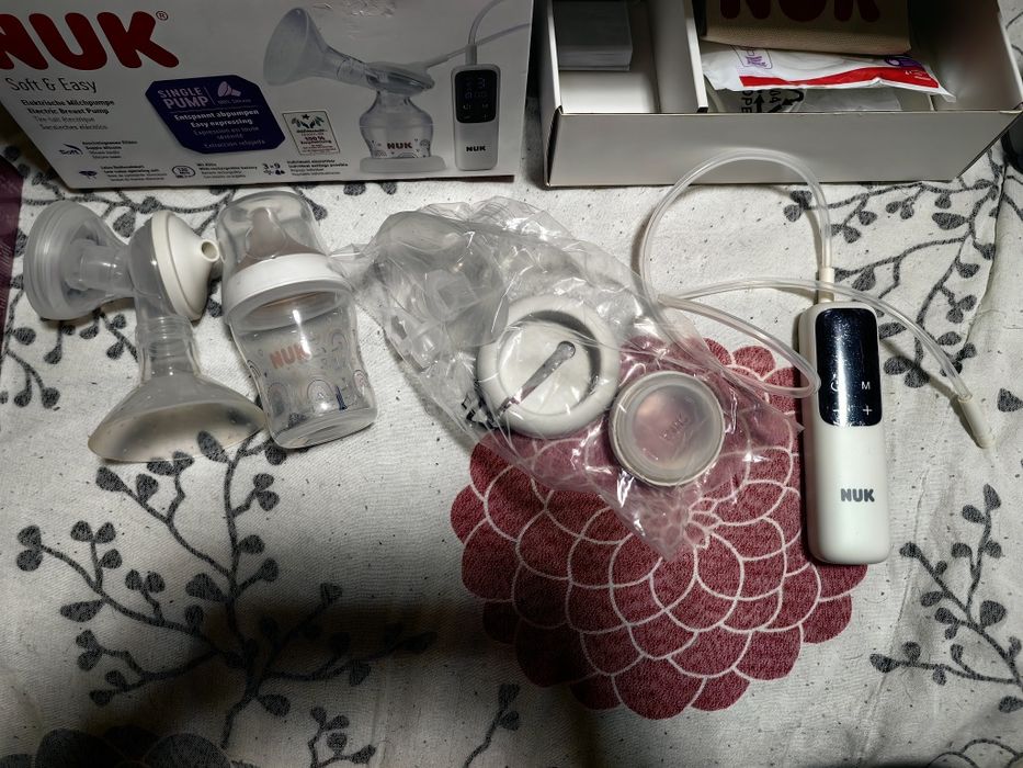 Електрическа помпа за кърма NUK и преносим нагревател за топлене мляко