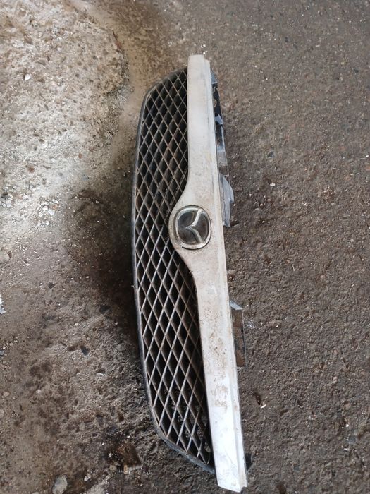 Решётка Мазда 323 на 1999г в оригинале