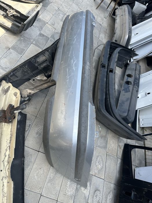 Задний бампер Мазда 626 птичка