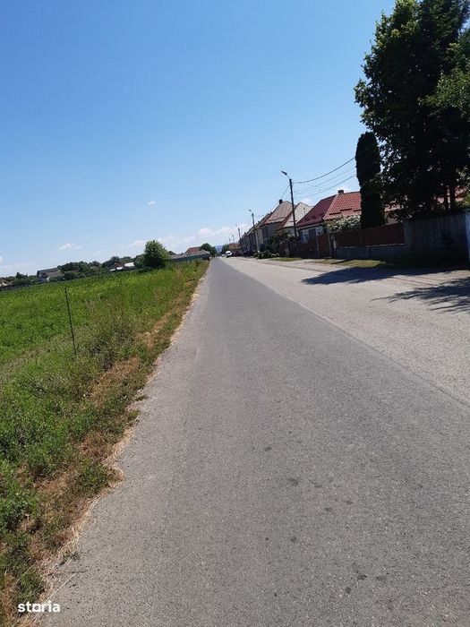 Vand teren construibil intravilan utilitati drum asfaltat central