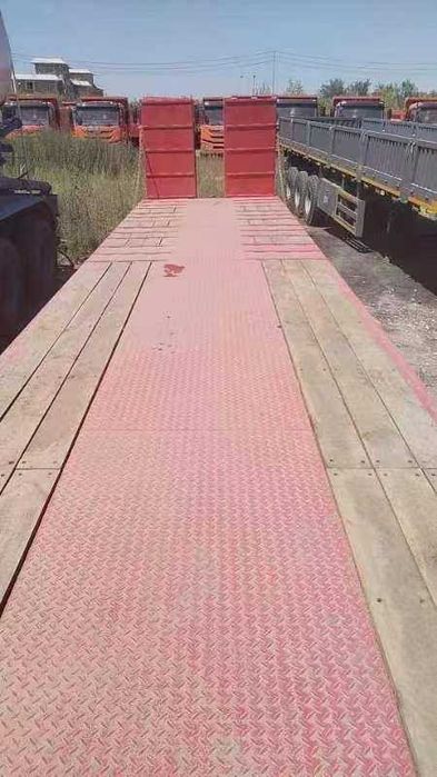 Полуприцеп тяжеловоз низкорамный Feilida-60т Tral podushka Orient Ozod