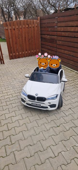 Mașinuța electrica BMW X6M 2 locuri
- centură de