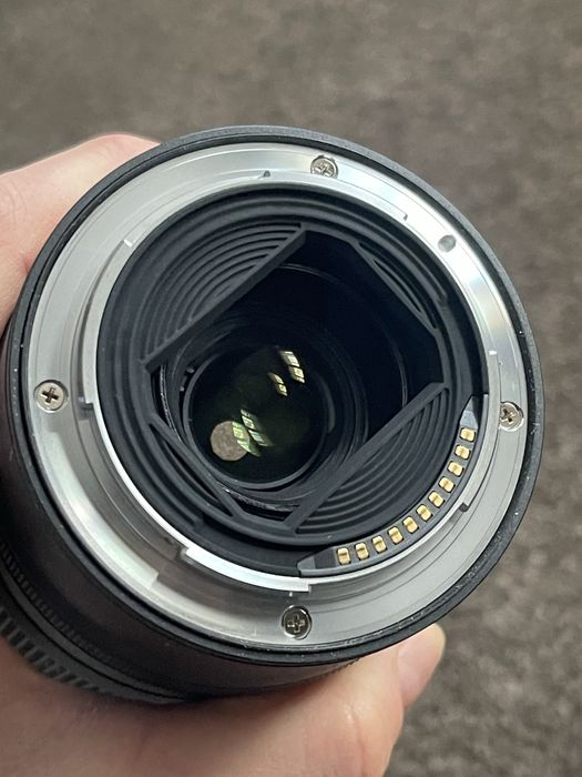 Обектив Nikkor 28-75 mm f/2.8 неразличим от нов
