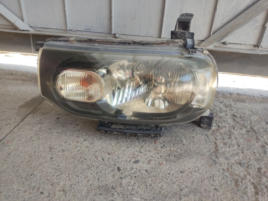Фара Nissan cube