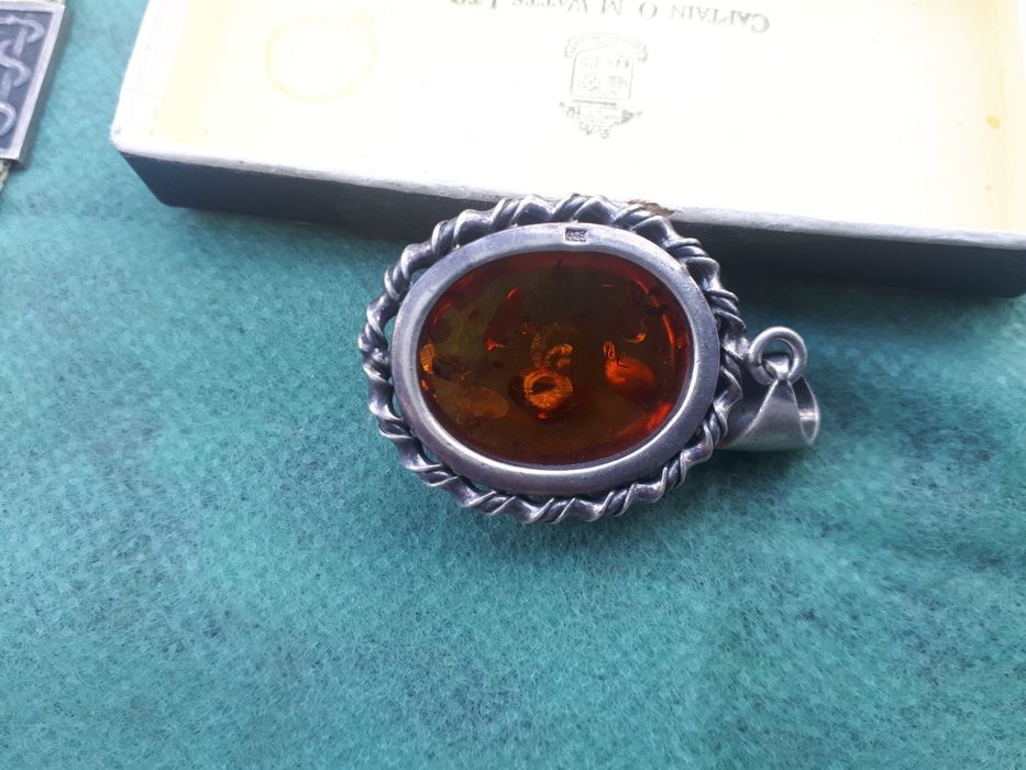 Серебряный кулон.