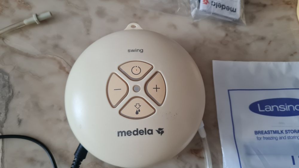 Електрическа помпа за кърма Medela Swing със зарядно (без шишета)