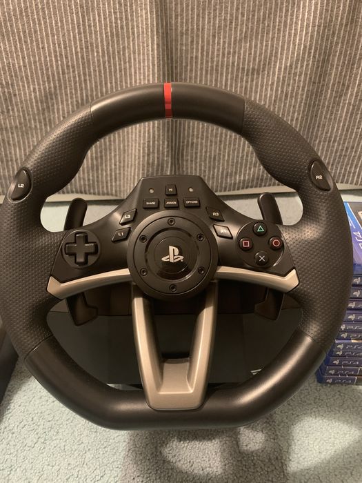 Volan PlayStation, pedale, și 12 jocuri