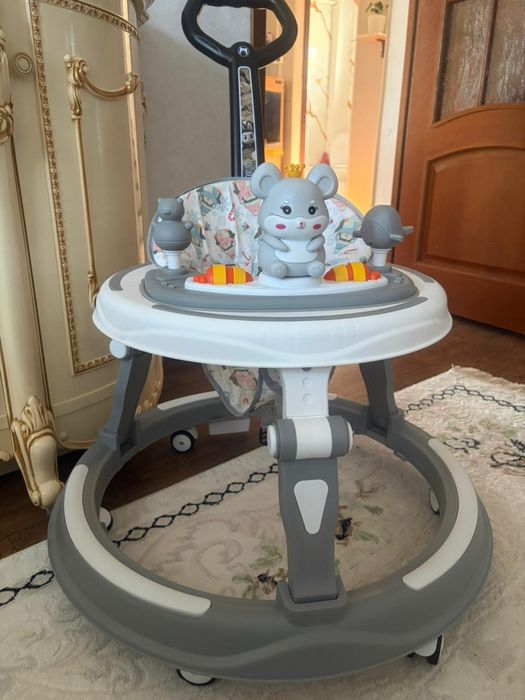 Детский ходунки предназначен для помочи ребенку