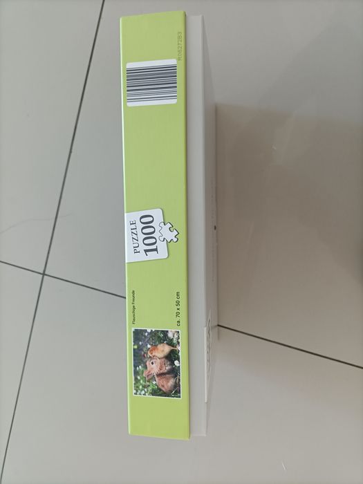 Puzzle de 1000 de piese - Iepuraș drăguț în iarbă