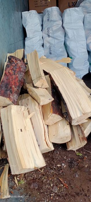 Дрова, в мешках.