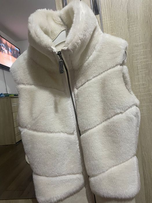 Vesta elegantă și călduroasă