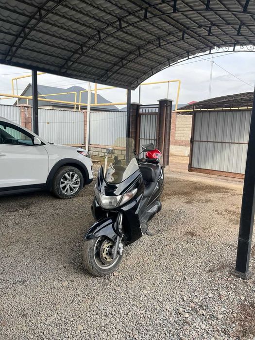 Максискутер Suzuki skyvei
