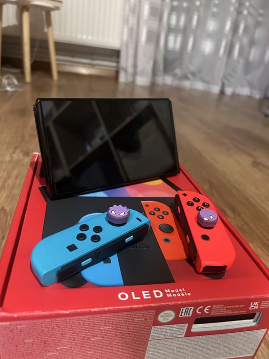 Nintendo Switch OLED + 2 jocuri + cutie + accesorii