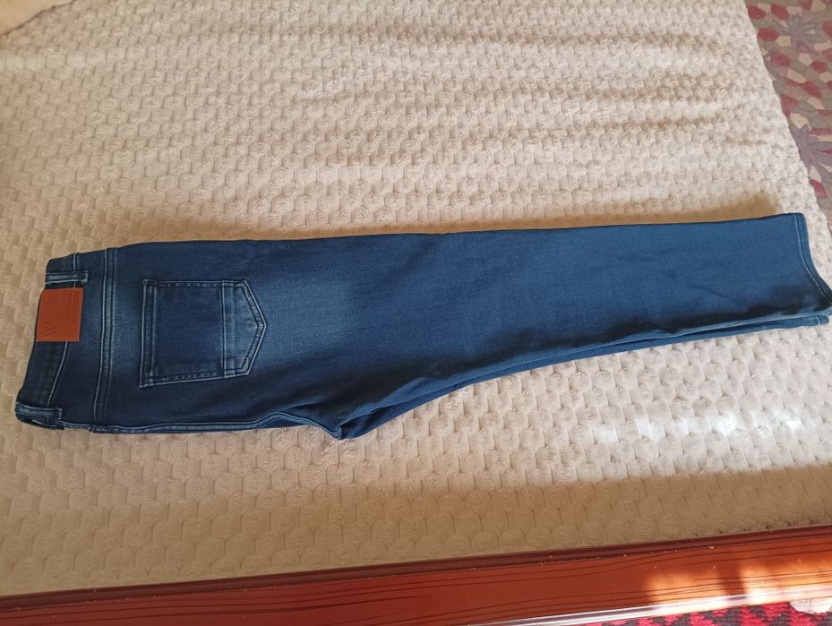 Джинсы на подростка 13-14 лет .