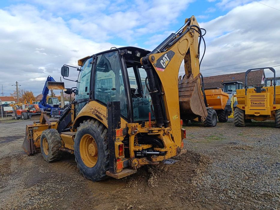 Buldoexcavator CATERPILLAR 428E , cupa multifunctionala