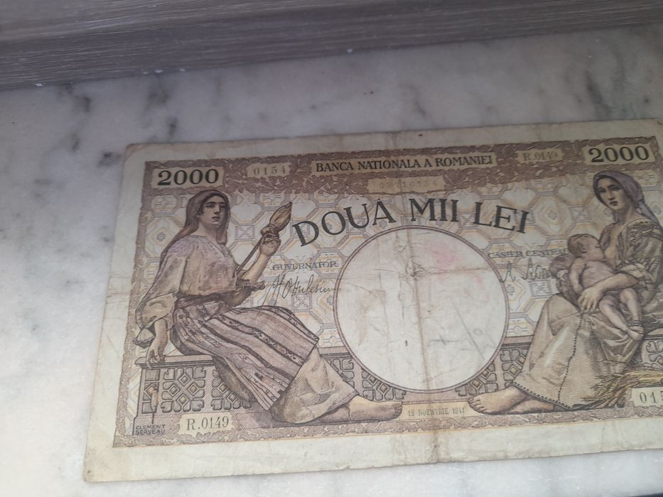 Vind 2 bacnote,1, 2000 lei si 1 cinci sute lei