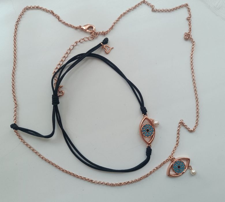 Комплект на Oxette колие и гривна в розово злато със синьо око