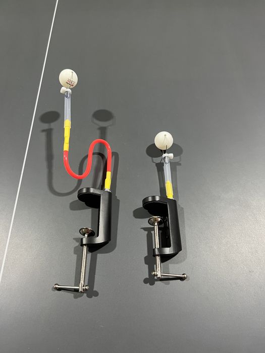 Учебный робот тренажер для настольного тенниса