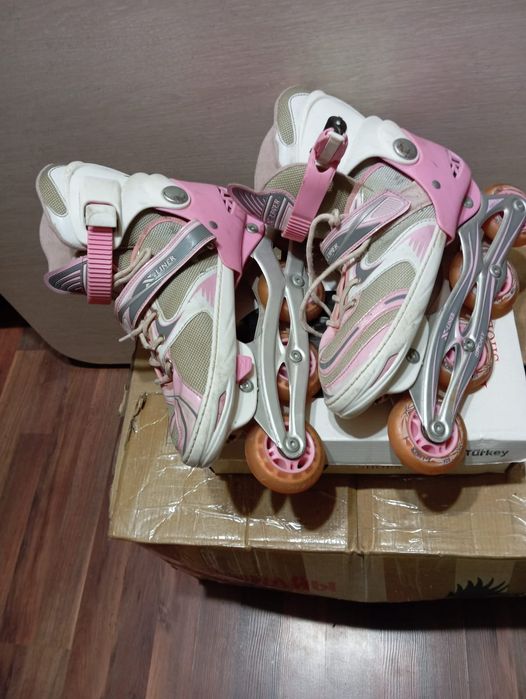 Роликовые коньки