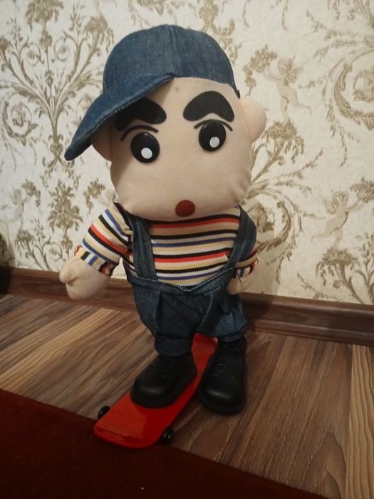 Музыкальная игрушка,мальчик на скейте.