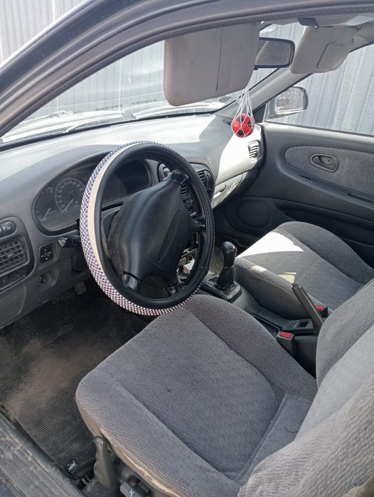 Митсубиси Лансер.