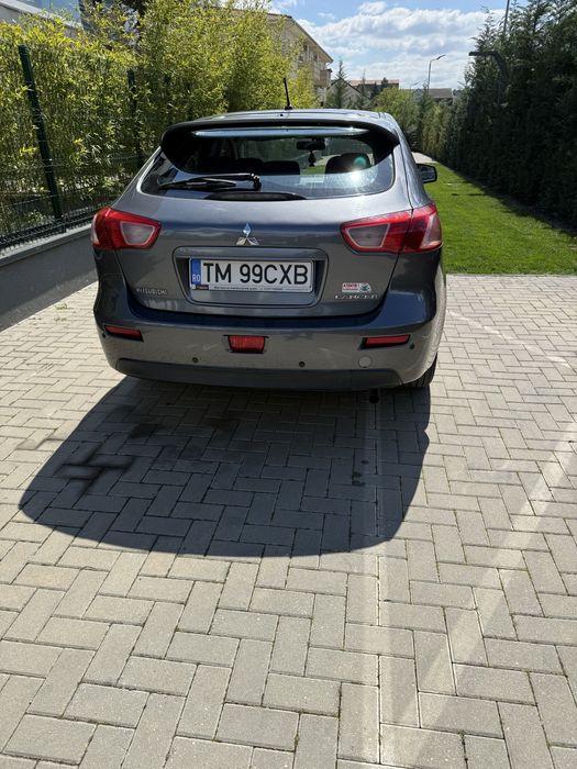 Vand sau schimb mitsubishi lancer!