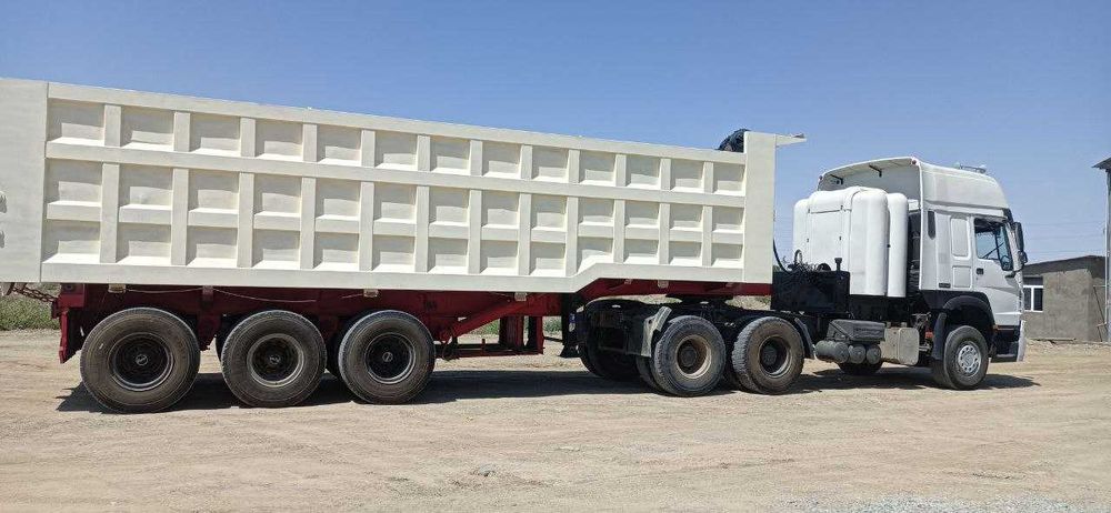 HOWO ТЯГАЧ заводской газ с прицепом  грузоплдъёмность 60 тонна