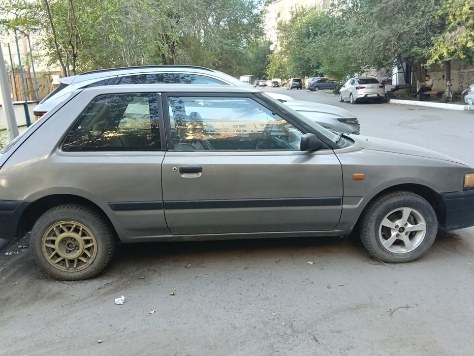 Мазда 323..механика,91г 700т.т