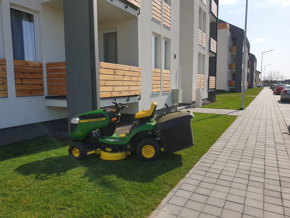 Intretinere parcuri fotovoltaice, tuns iarba in livezi, curățat teren