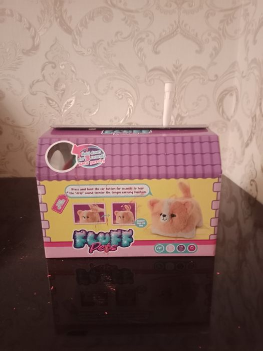 Продаю игрушечную пушистую кошку