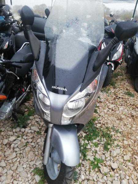 продавам мотор на части   honda fes 125k