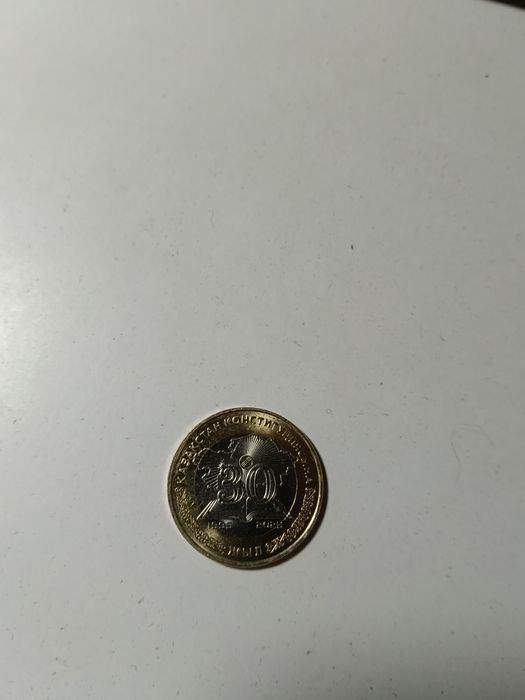 Продам монеты сто двести тенге