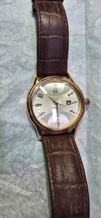 Золотые часы Ника