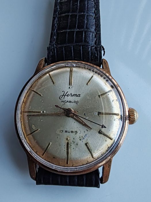 Ceas Herma Placat cu aur Int. Manuala Funcționează excelent!